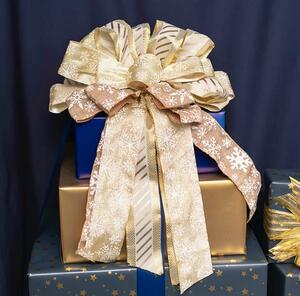 This pre-made large bow is perfect for placing at the top of your tree, or adding to a wreath, garland or for event decoration and table or wall display. 

This bow features 3 types of ribbon: 
Gold and cream striped ribbon that is 65mm wide and has 6 loops at the top. 
Natural linen ribbon with white snowflake print. The ribbon is 60mm wide and has 4 loops at the top. 
Gold ribbon with snowflake print in white. The ribbon is 60mm wide and has 4 loops at the top.

This bow is approximately 35cm wide and 40cm in length.
 You attach the bow with the twist tie supplied at the back of the bow. All ribbons are wire edged so you can style loops and tails to suit.

Sold as an individual bow.

SKU: 2119070GO

.
.
#kochandco #kochinspo #christmasbows #premadebows #christmastreetopper #christmasdecorations